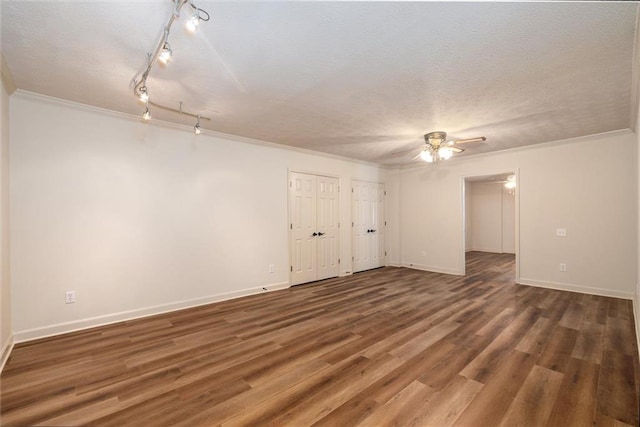 6141 Windsong Way, Smoke Rise, GA 30087 - spare room featuring ceiling fan, ornamental molding, a textured ceiling, wood finished floors, and baseboards