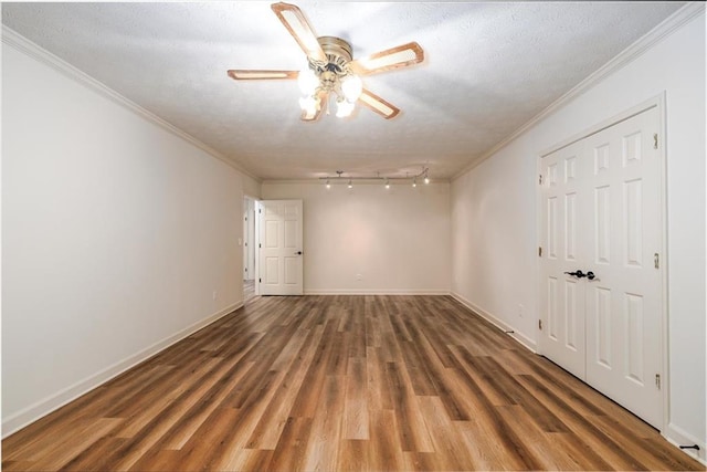 6141 Windsong Way, Smoke Rise, GA 30087 - unfurnished room featuring crown molding, wood finished floors, baseboards, a ceiling fan, and a textured ceiling