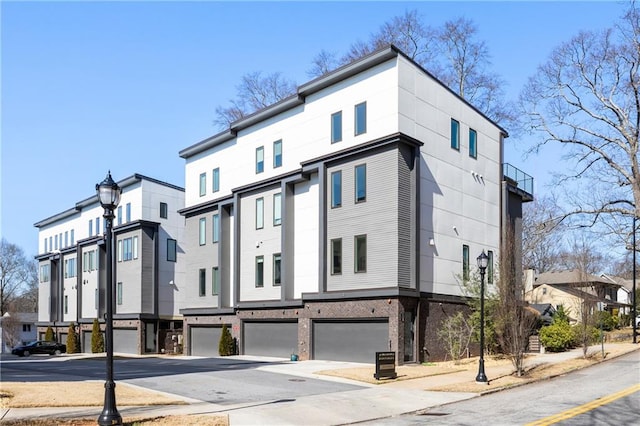 view of front of house featuring a garage and a residential view