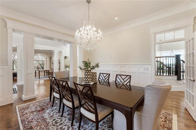 living area featuring a fireplace, a high ceiling, and wood finished floors