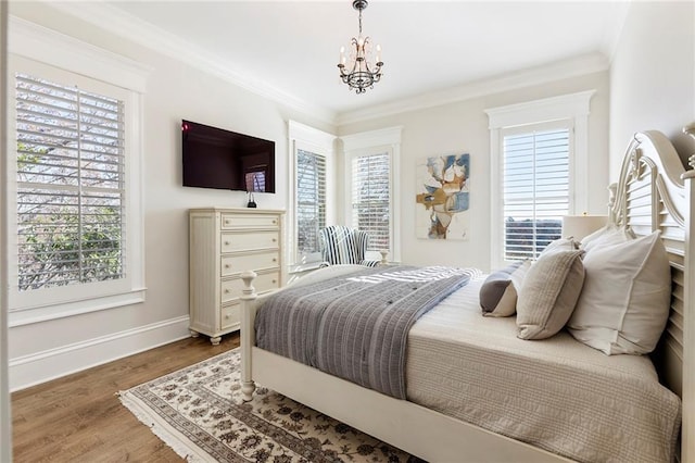 hallway featuring an upstairs landing, beamed ceiling, ornamental molding, and wood-type flooring