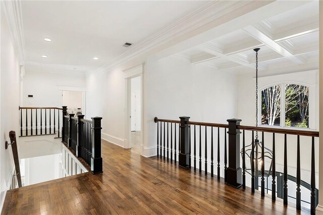 bedroom with visible vents, lofted ceiling with beams, baseboards, and wood finished floors