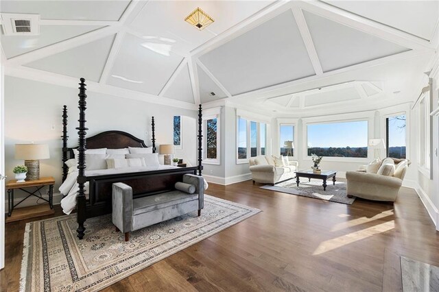 bedroom with a premium fireplace, high vaulted ceiling, and wood finished floors