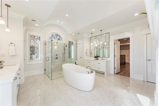 full bath with a freestanding tub, marble finish floor, crown molding, a premium fireplace, and vanity