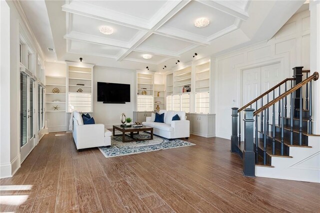 living room with french doors, beam ceiling, wood finished floors, and stairway