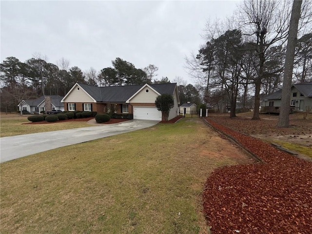 view of front of home with a garage, driveway, and a front lawn