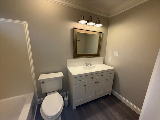 full bathroom with backsplash, baseboards, ornamental molding, wood finished floors, and vanity