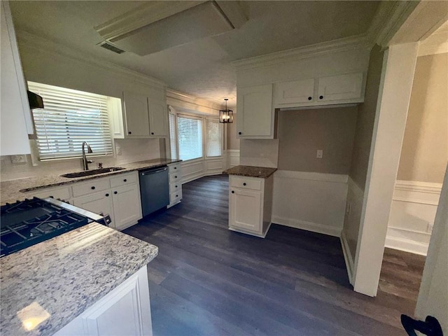 kitchen with visible vents, dishwasher, wainscoting, white cabinetry, and a sink