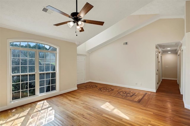 5410 Lenox Park Pl, Buford, GA 30518 - spare room with lofted ceiling, wood finished floors, baseboards, a ceiling fan, and crown molding