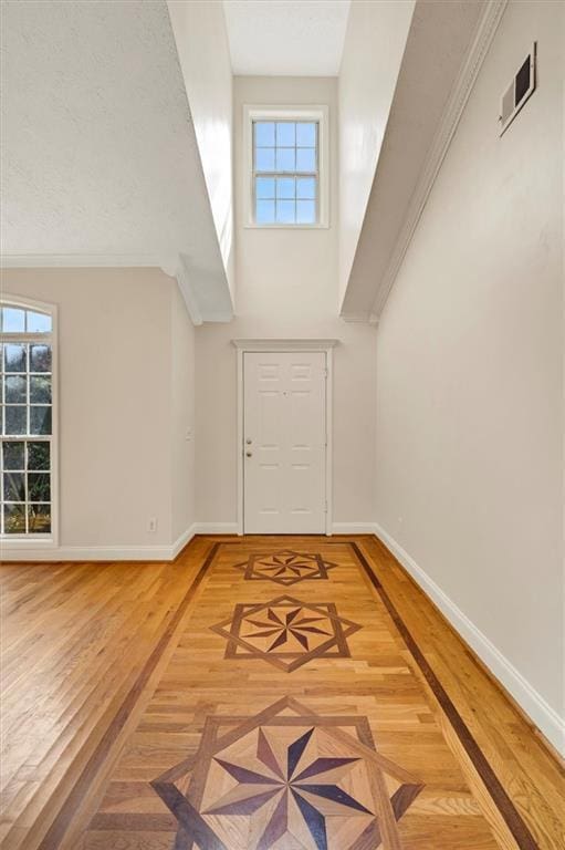 5410 Lenox Park Pl, Buford, GA 30518 - foyer entrance featuring baseboards, wood finished floors, and a towering ceiling