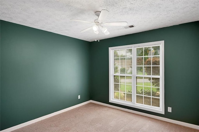 5410 Lenox Park Pl, Buford, GA 30518 - carpeted empty room featuring baseboards, ceiling fan, and a textured ceiling