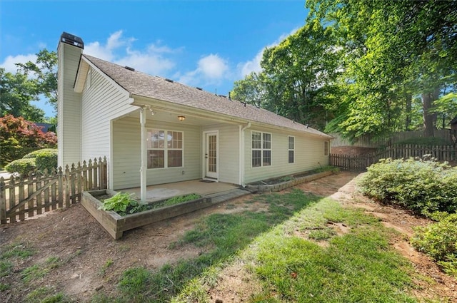 5410 Lenox Park Pl, Buford, GA 30518 - rear view of property with a patio and a chimney