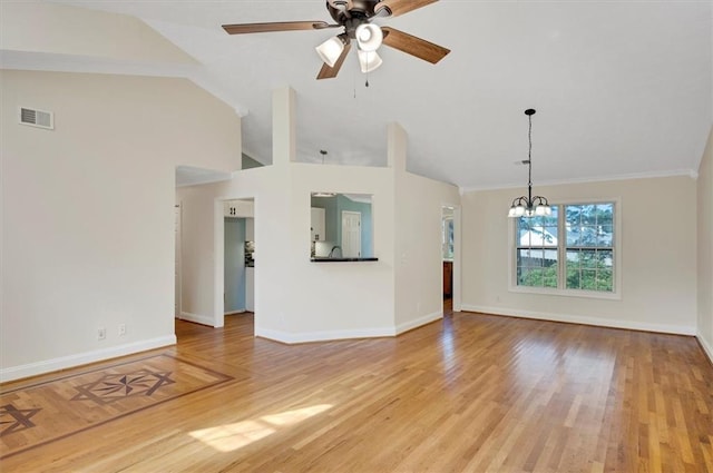 5410 Lenox Park Pl, Buford, GA 30518 - unfurnished living room with a chandelier, baseboards, a ceiling fan, lofted ceiling, and light wood-style flooring