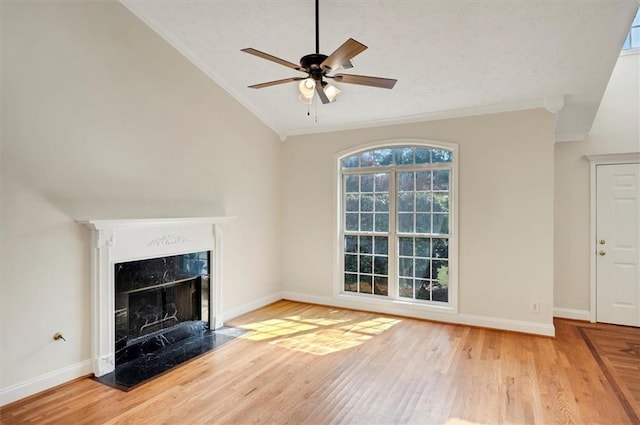 5410 Lenox Park Pl, Buford, GA 30518 - unfurnished living room with lofted ceiling, crown molding, wood finished floors, a ceiling fan, and baseboards