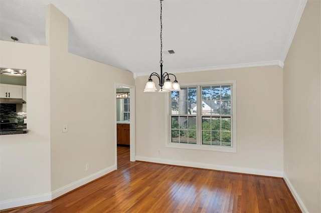 5410 Lenox Park Pl, Buford, GA 30518 - unfurnished dining area with ornamental molding, baseboards, a chandelier, and wood finished floors