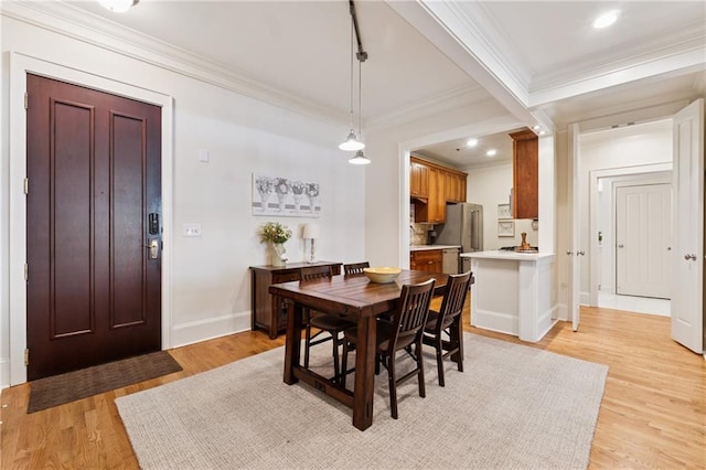 77 Peachtree Pl NE Unit 101, Atlanta, GA 30309 - dining area featuring crown molding, light wood-style floors, and recessed lighting