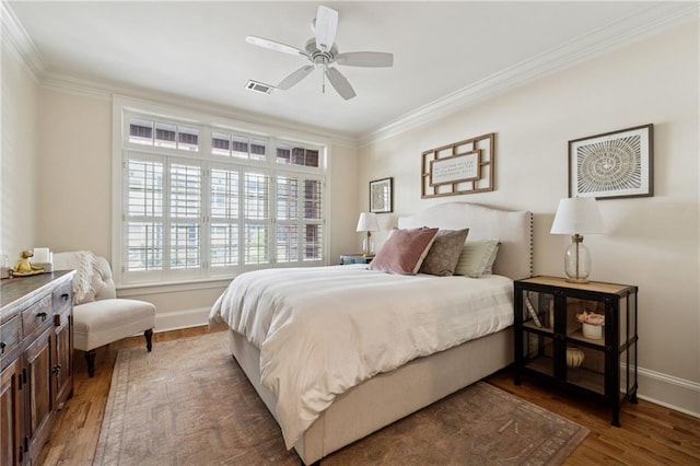 77 Peachtree Pl NE Unit 101, Atlanta, GA 30309 - bedroom featuring crown molding, wood finished floors, and a ceiling fan