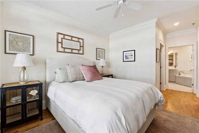 77 Peachtree Pl NE Unit 101, Atlanta, GA 30309 - bedroom featuring ornamental molding, wood finished floors, recessed lighting, ensuite bathroom, and ceiling fan