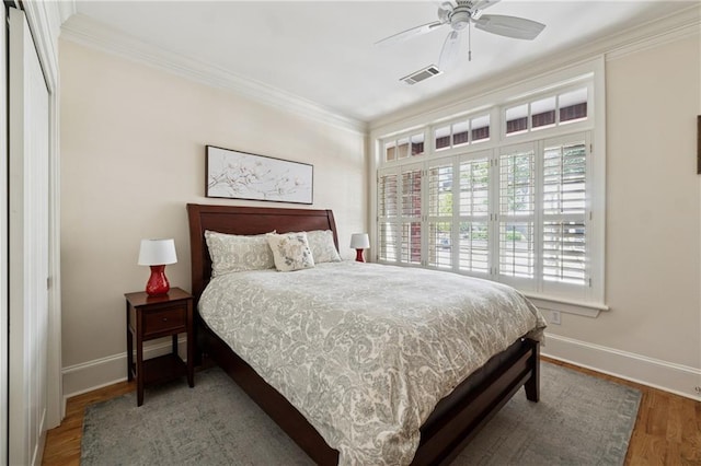 77 Peachtree Pl NE Unit 101, Atlanta, GA 30309 - bedroom featuring ornamental molding and wood finished floors