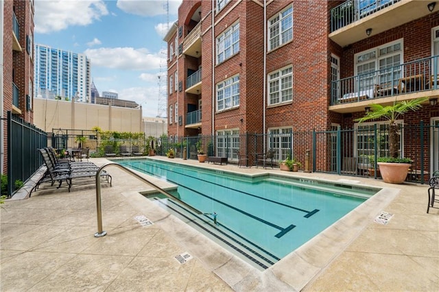 77 Peachtree Pl NE Unit 101, Atlanta, GA 30309 - community pool featuring a patio