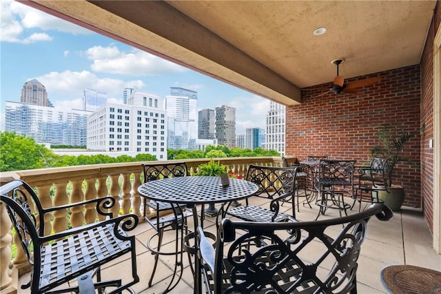 77 Peachtree Pl NE Unit 101, Atlanta, GA 30309 - balcony featuring a skyline view and outdoor dining area