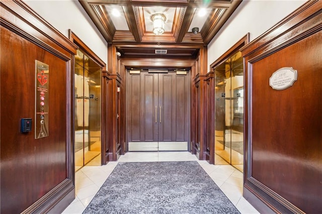 77 Peachtree Pl NE Unit 101, Atlanta, GA 30309 - hall featuring light tile patterned floors, beamed ceiling, ornamental molding, and elevator