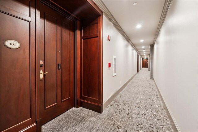 77 Peachtree Pl NE Unit 101, Atlanta, GA 30309 - hall featuring ornamental molding, recessed lighting, and light colored carpet