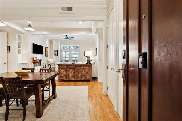 77 Peachtree Pl NE Unit 101, Atlanta, GA 30309 - dining room featuring crown molding, light wood finished floors, and a ceiling fan