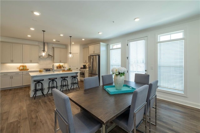 dining room featuring recessed lighting, dark wood finished floors, and baseboards