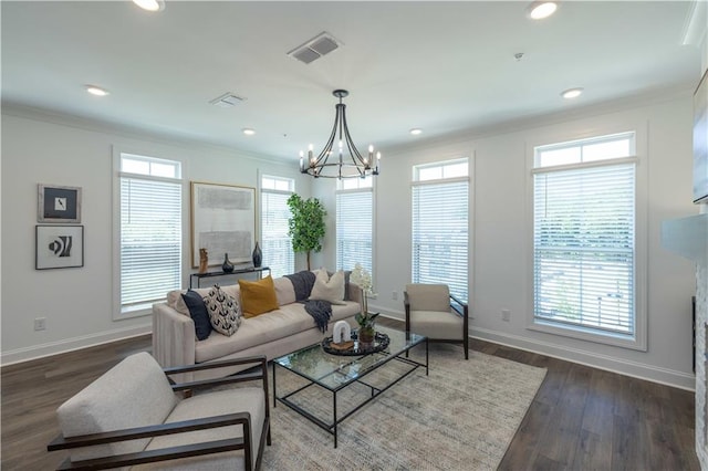 living area featuring crown molding, baseboards, wood finished floors, and recessed lighting