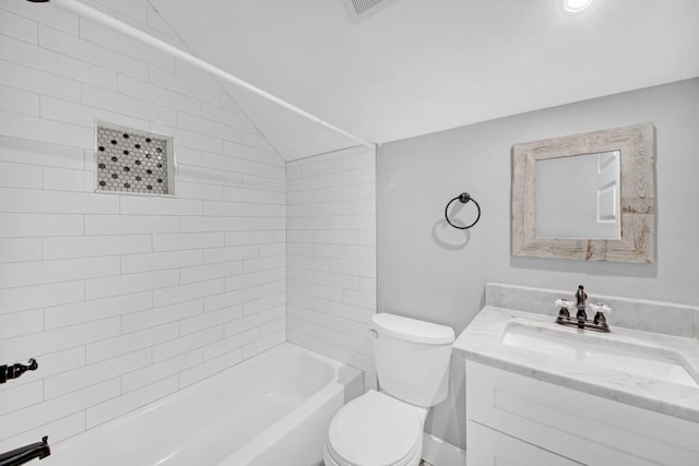 full bathroom featuring toilet, lofted ceiling, tiled shower / bath combo, and vanity