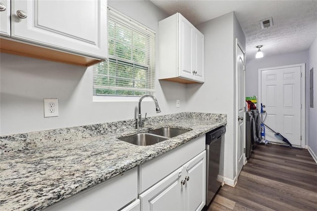 kitchen featuring dishwasher, a textured ceiling, white cabinets, light stone counters, and sink