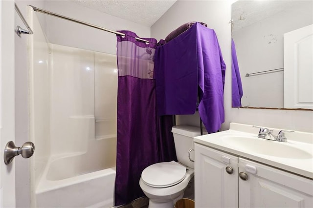 full bathroom featuring a textured ceiling, toilet, vanity, and shower / bath combo with shower curtain