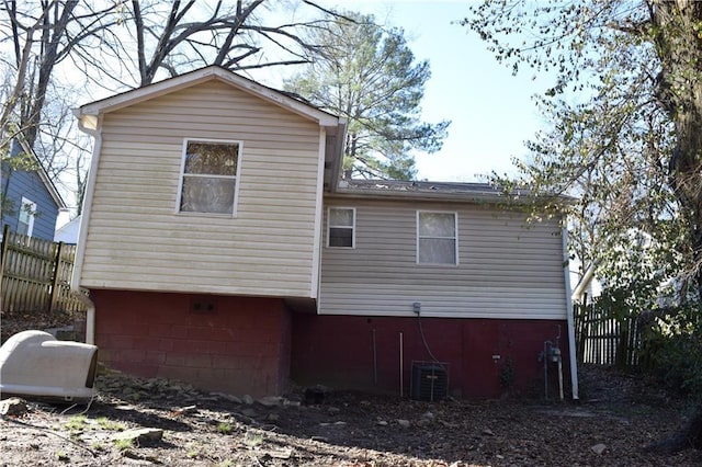 back of property with fence