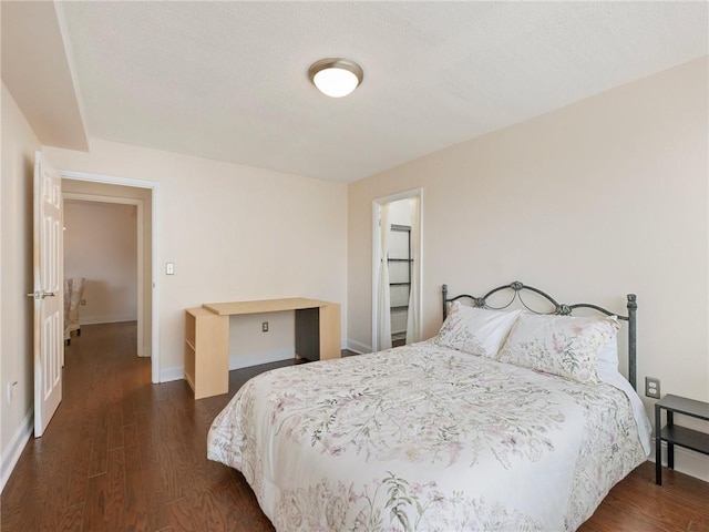 2479 Peachtree Rd NE Unit 407, Atlanta, GA 30305 - bedroom with dark wood-style flooring and baseboards