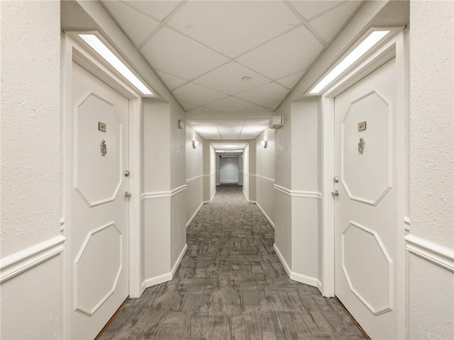 2479 Peachtree Rd NE Unit 407, Atlanta, GA 30305 - corridor featuring a drop ceiling, carpet flooring, and baseboards