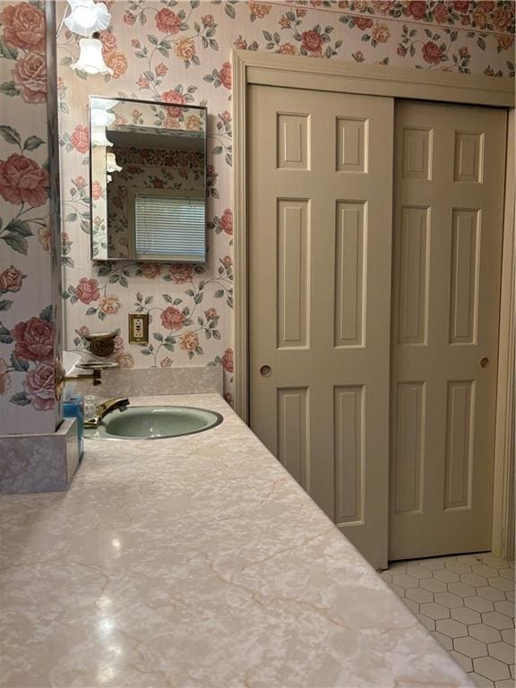 bathroom with tile patterned floors and vanity