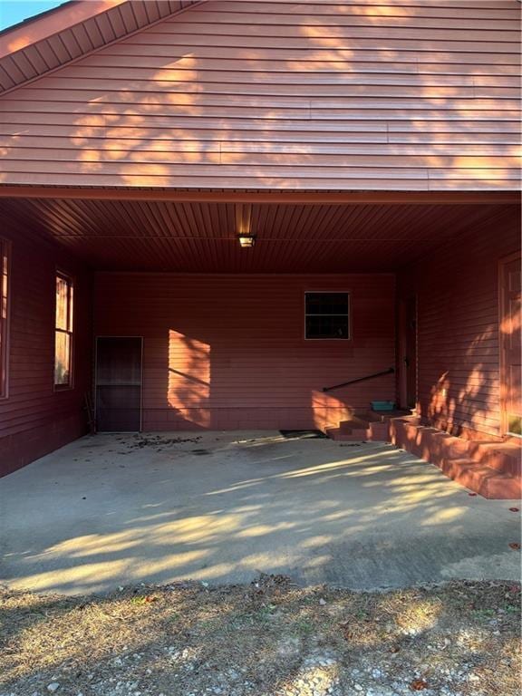 view of vehicle parking with a carport