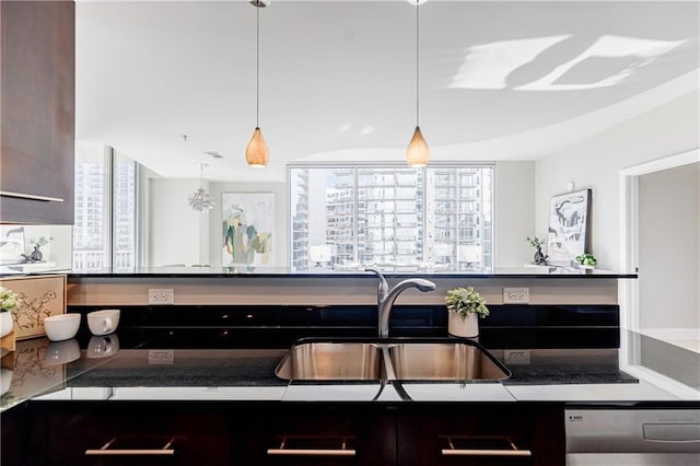 kitchen with pendant lighting, sink, plenty of natural light, and dishwasher