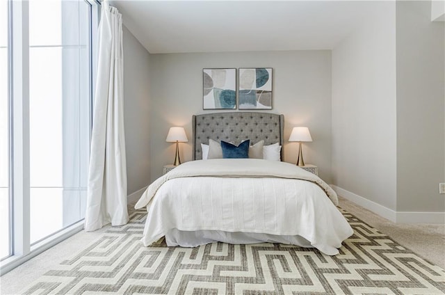 bedroom featuring light carpet