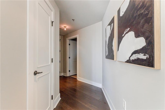 hall with dark hardwood / wood-style floors