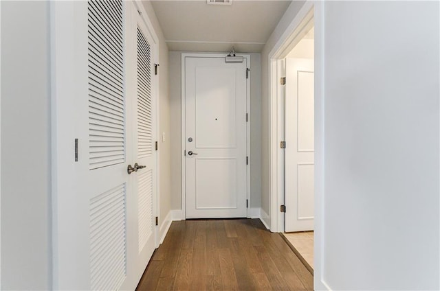 hallway featuring hardwood / wood-style flooring