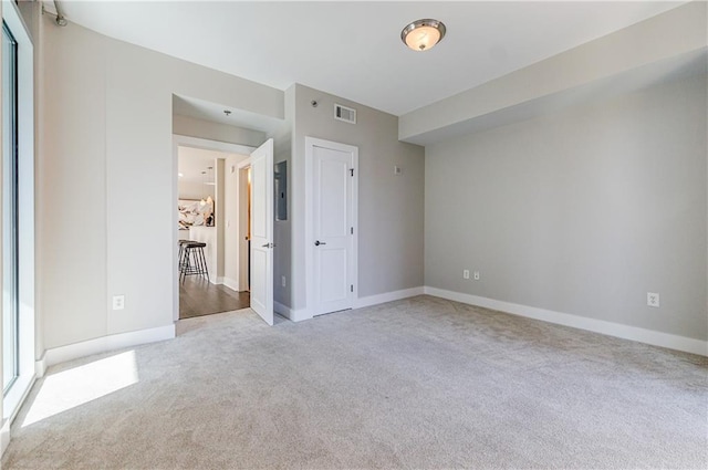 unfurnished bedroom featuring light colored carpet