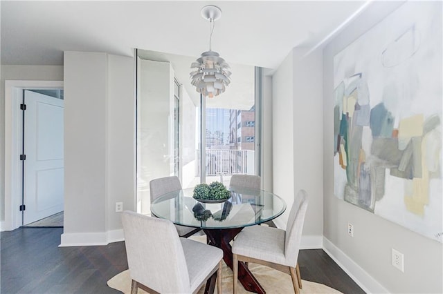 dining room with dark hardwood / wood-style flooring