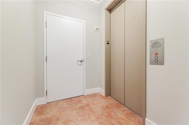 hallway featuring elevator