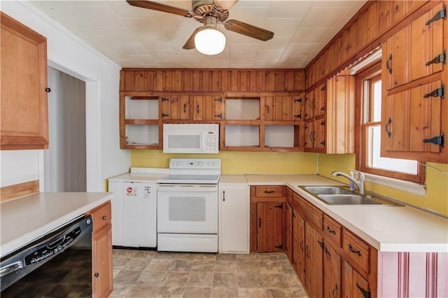 kitchen featuring open shelves, white appliances, a sink, and light countertops