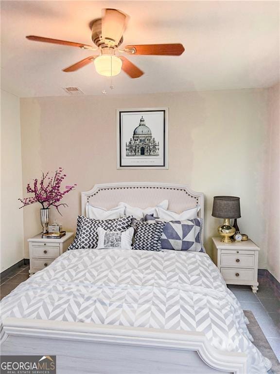 5770 Satterfield Dr, Macon, GA 31206 - bedroom featuring dark tile patterned floors and a ceiling fan