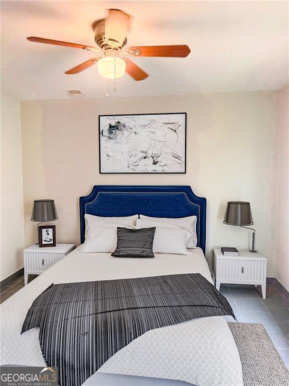 5770 Satterfield Dr, Macon, GA 31206 - bedroom featuring a ceiling fan and tile patterned flooring