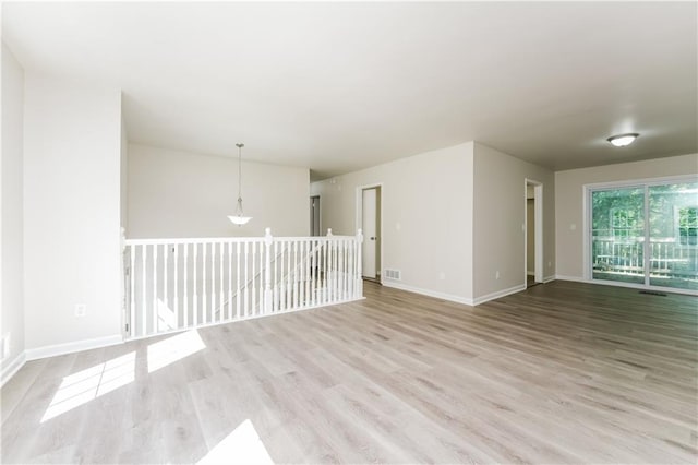 unfurnished room featuring light hardwood / wood-style flooring