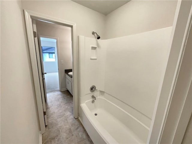 bathroom featuring vanity and shower / bathing tub combination